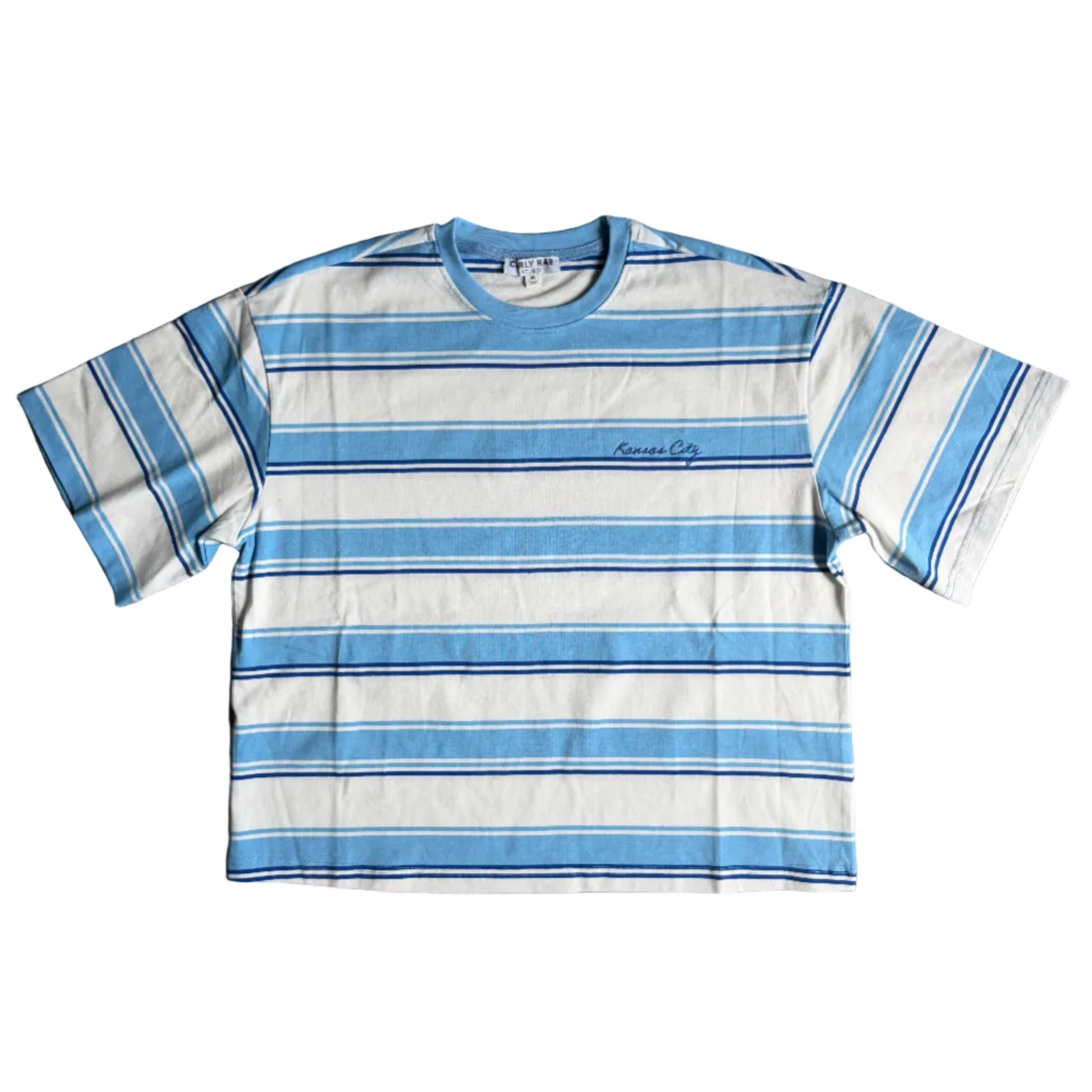 Blue and white striped t-shirt on a wooden floor with a visible brand logo.
